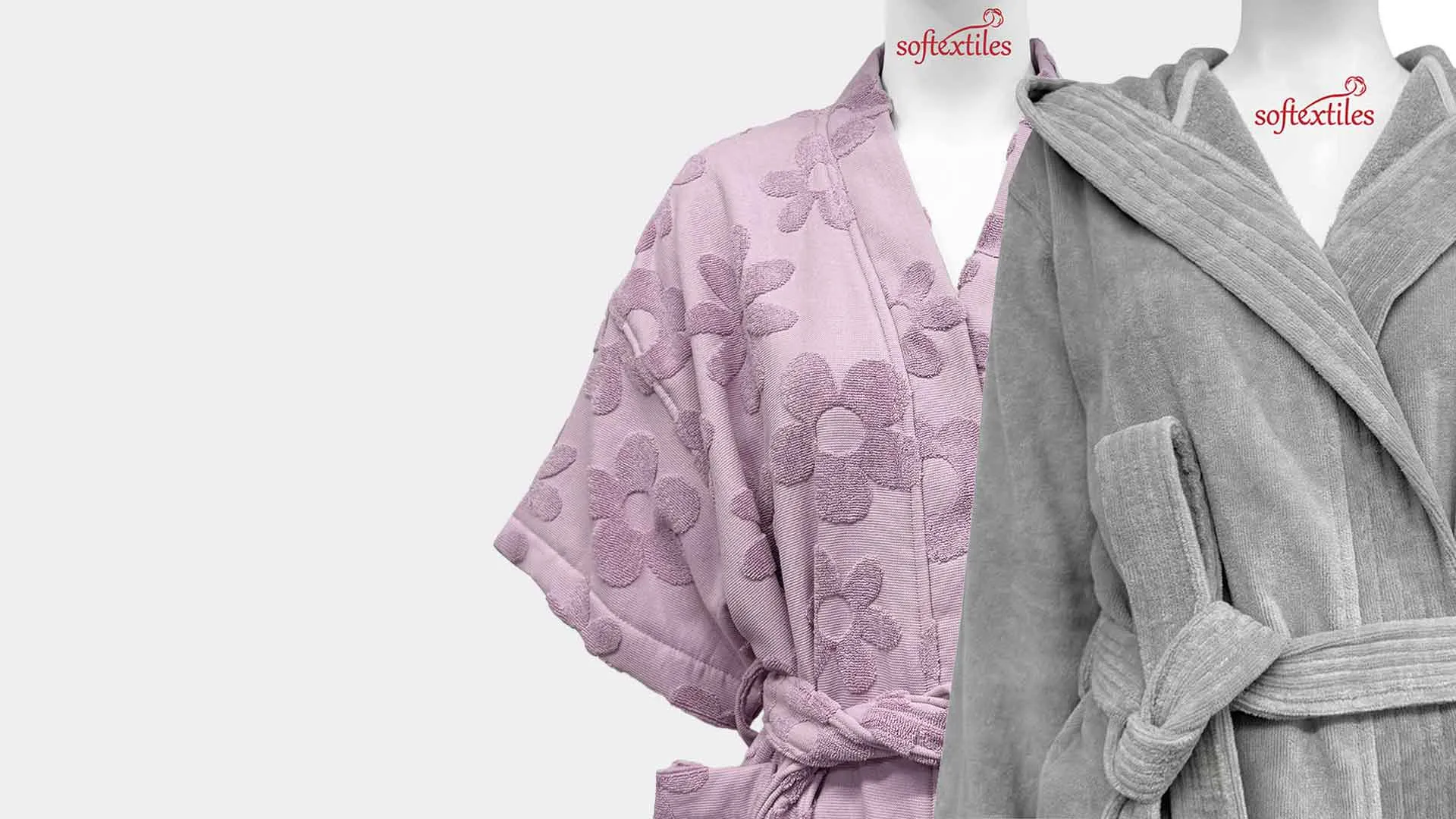 Pink floral terry bathrobe paired with a grey hooded robe for soft hospitality collections.