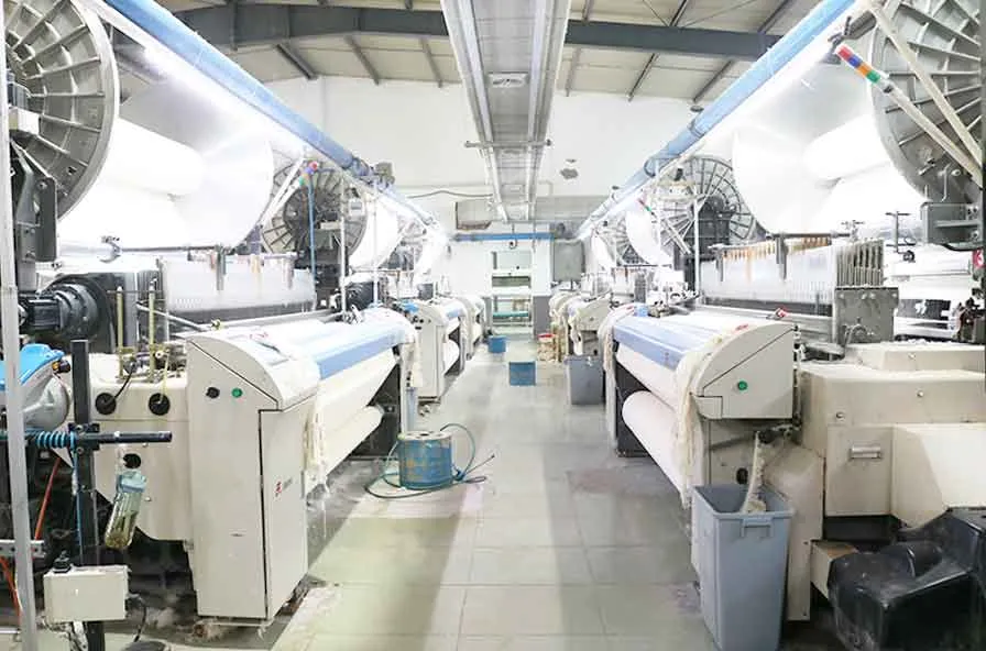 Softextiles fabric weaving stage for hospitality bathrobe production.